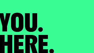 green background with black lettering: YOU.HERE.